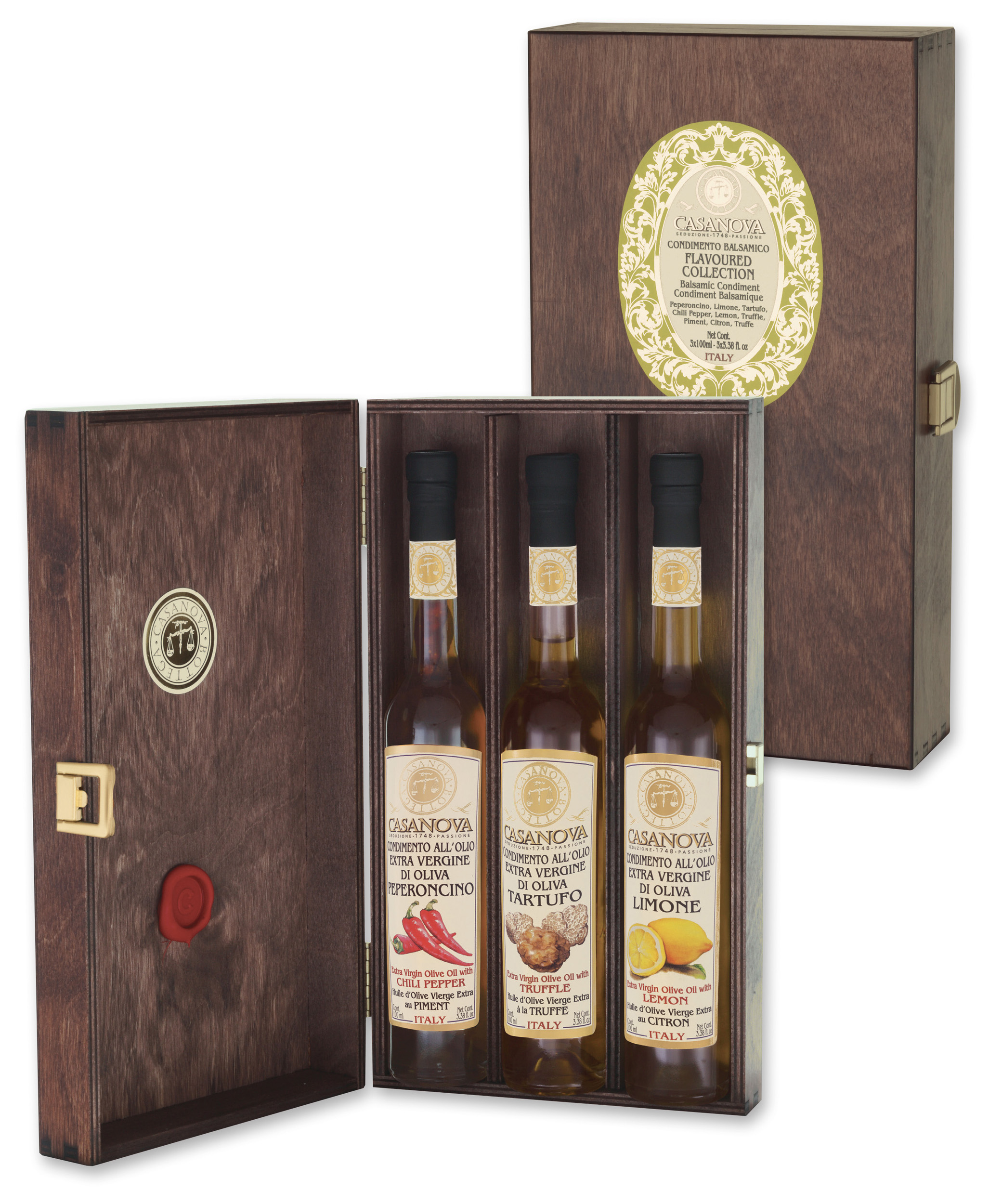 Three flavoured Oils: Chili Pepper – Truffle – Lemon 3x100 ml Casanova, wooden gift box with three bottles.
